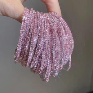 Close-up of sparkling pink rhinestone elastic bracelets with high-end luxury shine
