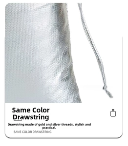 Detailed view of silver metallic drawstring bag showing fabric texture and drawstring