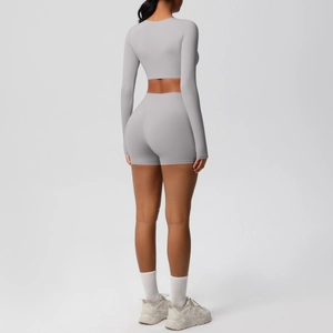 Back view of light grey long sleeve crop top and high waist sports shorts set