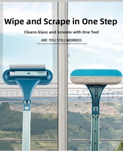 Double-sided window cleaning brush detail, dual-use scraper and screen wiper tool.