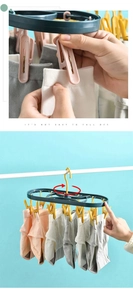 Detail showing 360-degree rotating hook and 12 anti-slip clips for drying small items