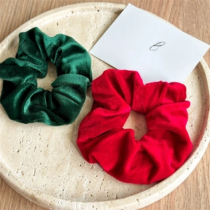 Red and dark green velvet scrunchie set with ribbed texture and high elasticity