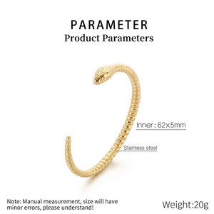Macro shot of gold snake-shaped stainless steel bracelet with detailed scale texture