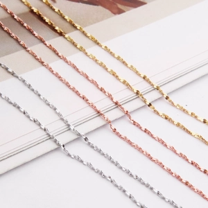 Detailed shot of s925 silver star necklaces in gold, rose gold and silver finishes