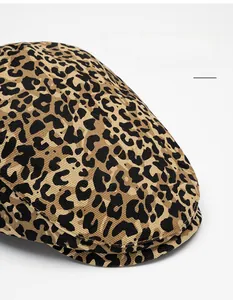 Detail of leopard print cotton beret showing fabric texture and wide foldable brim