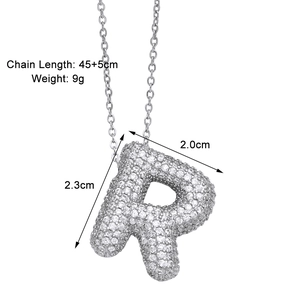 Macro view of R-letter pendant with cubic zirconia and size specifications in inches