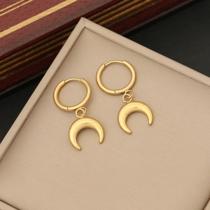 Minimalist double-layer moon pendant necklace in gold finish on a beige jewelry tray