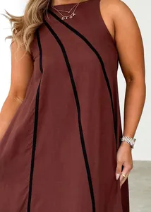 Close-up of sleeveless reddish-brown dress featuring diagonal black striped stitching texture