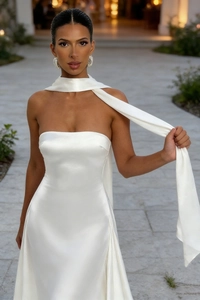 Elegant white strapless satin maxi dress with matching silk scarf and glossy finish
