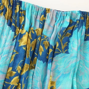 Blue floral pleated chiffon tiered dress featuring ruffled strapless holiday style