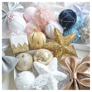 Detail of assorted Christmas tree ornaments with glitter, sequins and velvet textures