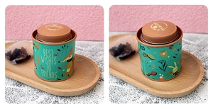 Detail view of round tin canister with cute fox illustration and double lid closure
