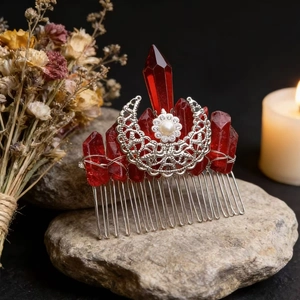 Handmade silver crescent moon hair comb with red crystals and pearls on a stone base