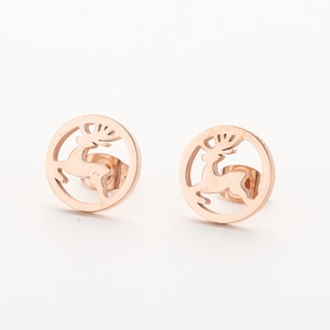 Macro shot of rose gold reindeer earrings featuring a hollow circular frame