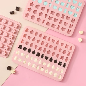 Pink silicone DIY molds for candy and chocolate with animal and fruit shapes