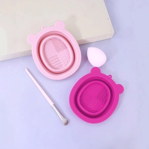 Bear-shaped silicone makeup brush cleaning pads with textured surfaces in pink and rose