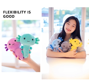 Multiple colors of soft plush axolotl toys being held to show flexibility and texture
