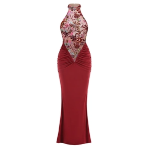 Close-up of floral embroidery and sequin details on the sheer mesh halter neckline