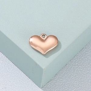Polished rose gold heart-shaped pendant in stainless steel with round hanging ring