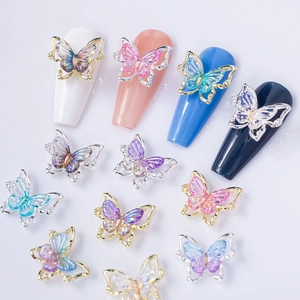 Luxury 3D laser butterfly nail art charms with iridescent wings and golden metal frames
