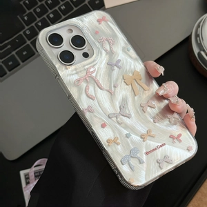 Close-up of wavy texture iPhone case with colorful 3D bows and star patterns