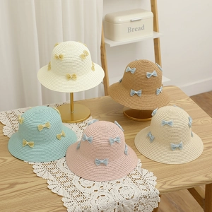 Detail showing variety of sun hats with sweet lace bowknots in five pastel colors