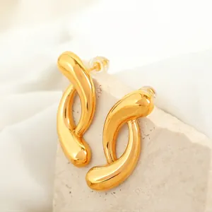 Irregular geometric hoop earrings in 18k gold plated titanium with mirror finish