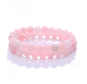 Detailed close-up of two natural pink quartz beaded bracelets on a clean white background