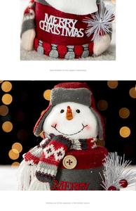 Detail of felt Christmas gift box lid with snowman motif and Merry Christmas text