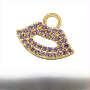 Macro shot of 11.5x15mm gold lip pendant with micro-set purple zircon and hanging ring