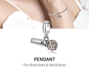 Detail of silver microphone pendant with champagne stones for bracelets and necklaces