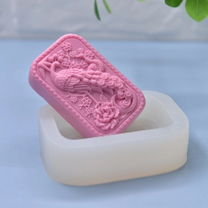 Peacock and peony flower silicone mold with finished pink craft soap sample
