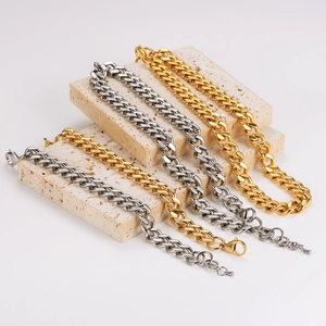 Chunky stainless steel curb chains in gold and silver finish on decorative stone