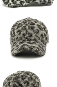 Detailed close-up showing thick leopard print teddy fleece texture on the baseball cap