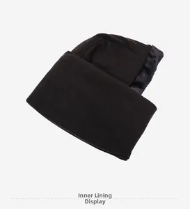 Detailed close-up of the thick faux fur lining inside the black thermal winter beanie