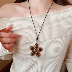 Vintage oval resin flower pendant necklace with tiger eye stones on black woven cord
