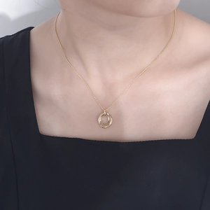 Elegant s925 silver gold double interlocking ring necklace worn on a female neck
