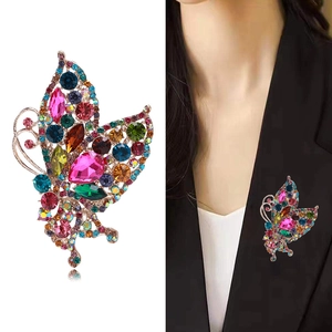 Luxury butterfly brooch with colorful rhinestones on a black suit jacket for women
