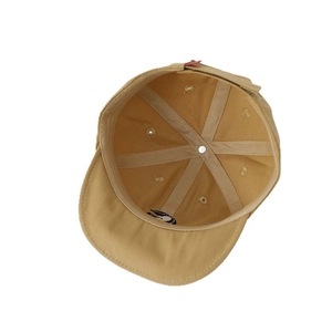 Inside view of khaki cotton baby baseball cap showing six-panel stitch construction