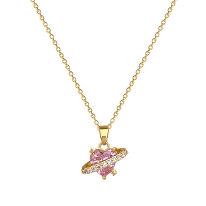 Gold heart planet necklace with pink crystal and zircon stones on white background