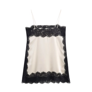 Ivory satin camisole top with black straps and delicate eyelash lace trim details