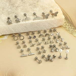 Set of minimalist stainless steel stud earrings with stars hearts and pearls motifs