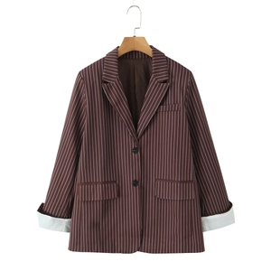 Detailed view of women's brown striped blazer with notch lapels and button closure