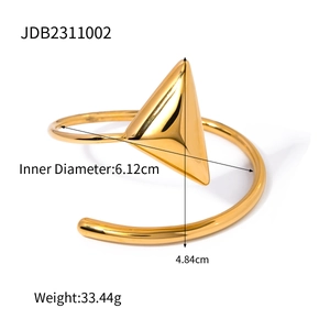 Detailed view of 18k gold stainless steel bangle with dimensions and weight specs