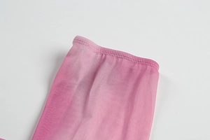 Detail of pink tie-dye mesh fabric showing delicate hem stitching and sheer texture