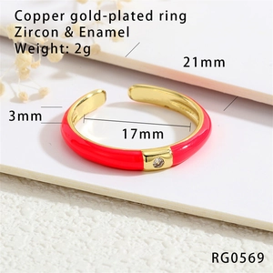 Detailed shot of 18K gold plated copper ring with red enamel and inlaid zircon accents
