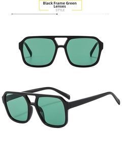 Detail view of vintage square sunglasses with black frame and green lenses in dual beams