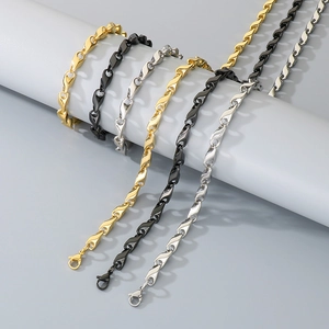 Rhombus link bracelet set in gold, black, and silver finishes with lobster clasp detail