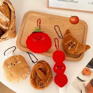 Creative food plush keychains featuring tomato, croissant, pretzel and cookie charms