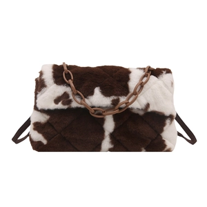 Brown cow pattern plush shoulder bag with chunky chain handle and quilted texture
